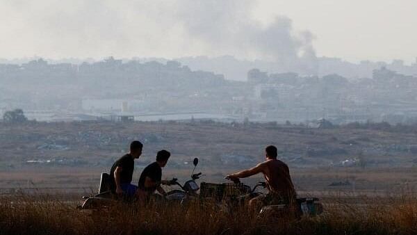 <div class="paragraphs"><p>Israelis look on at northern Gaza on a viewpoint near the border, amid the ongoing conflict in Gaza between Israel and Hamas, as seen from Israel, November 9, 2024. </p></div>