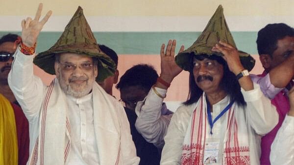 <div class="paragraphs"><p>Union Home Minister Amit Shah with NDA candidate Gopal Krishna Patar alias Raja Peter during a public meeting ahead of Jharkhand Assembly elections, in Ranchi, Monday.&nbsp;</p></div>