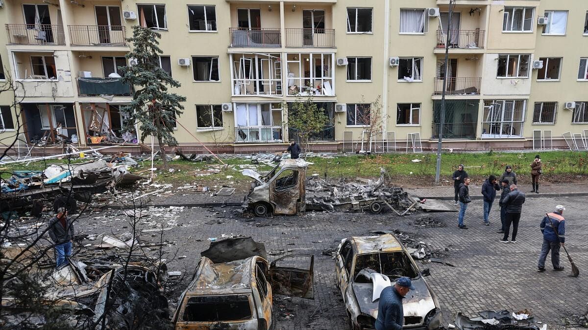 <div class="paragraphs"><p>Residents gather next to their destroyed cars and a damaged apartment building hit by a Russian drone strike, amid Russia's attack on Ukraine, in Odesa, Ukraine November 9, 2024.</p></div>