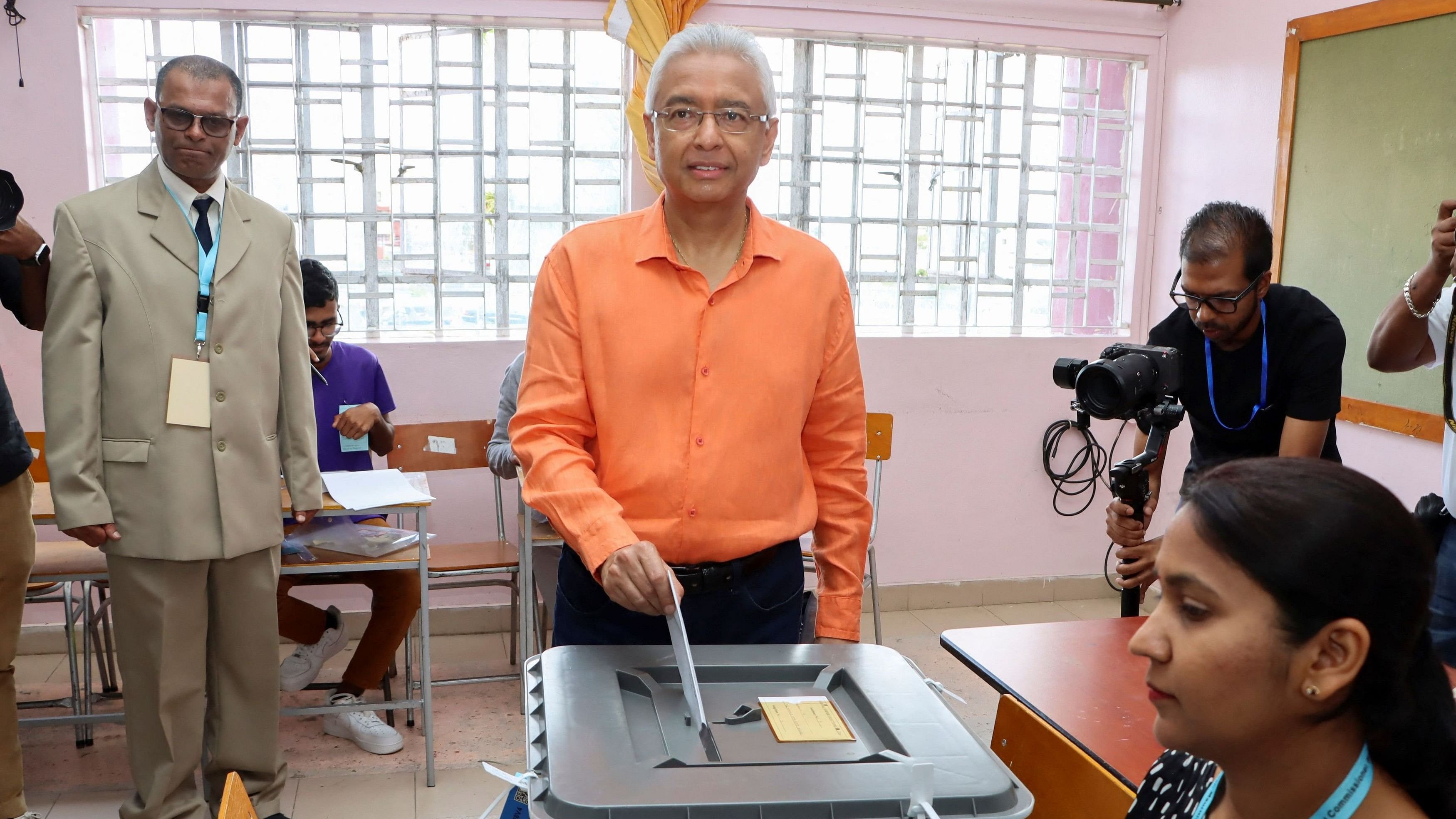 <div class="paragraphs"><p>Prime Minister of Mauritius and candidate for the Militant Socialist Movement  Pravind Jugnauth casts his ballot at a polling centre during the Mauritian general election.&nbsp;</p></div>