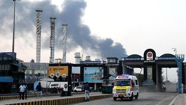 <div class="paragraphs"><p>An ambulance moves as smoke billows from an Indian Oil Corporation (IOC) refinery after a fire in Vadodara in the western state of Gujarat, India.&nbsp;</p></div>