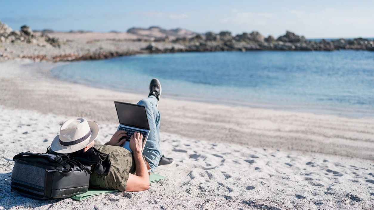 <div class="paragraphs"><p>Image showing a person working from a beach. For representational purposes.</p></div>