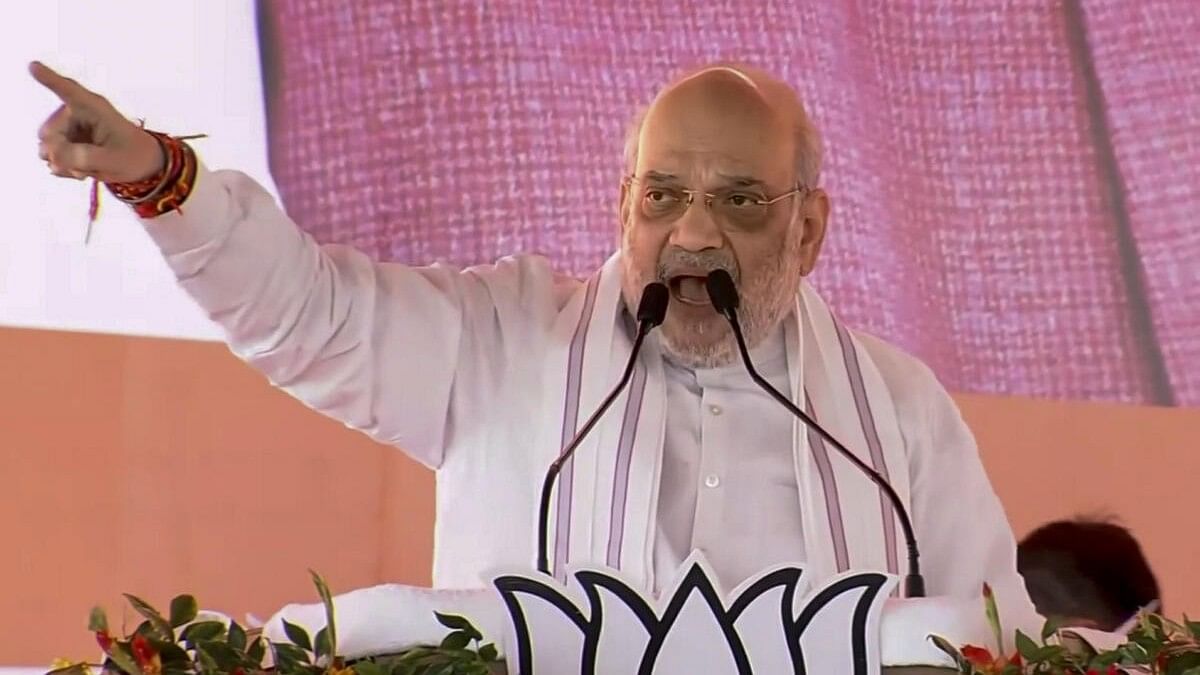 <div class="paragraphs"><p>Jharia: Union Home Minister Amit Shah addresses a public meeting for the Jharkhand Assembly election, in Jharia, Jharkhand.</p></div>