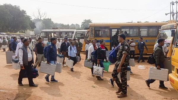 <div class="paragraphs"><p>Polling officials carrying EVMs leave for their respective polling stations ahead of voting in the first phase of Jharkhand Assembly elections.</p></div>