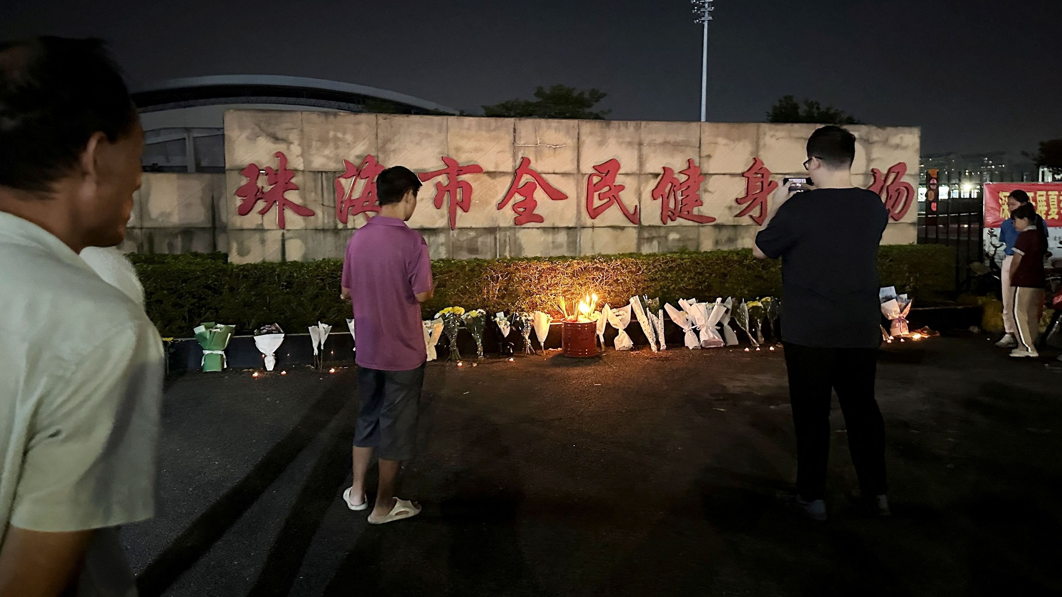 <div class="paragraphs"><p>Candles and floral tributes are laid outside a sports centre where a deadly hit-and-run attack took place, in Zhuhai, Guangdong province, China November 12, 2024. </p></div>