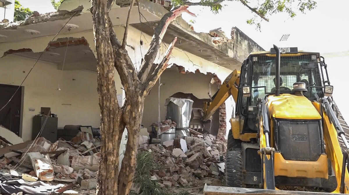 <div class="paragraphs"><p>Representative image of a bulldozer being used to demolish a house.&nbsp;</p></div>