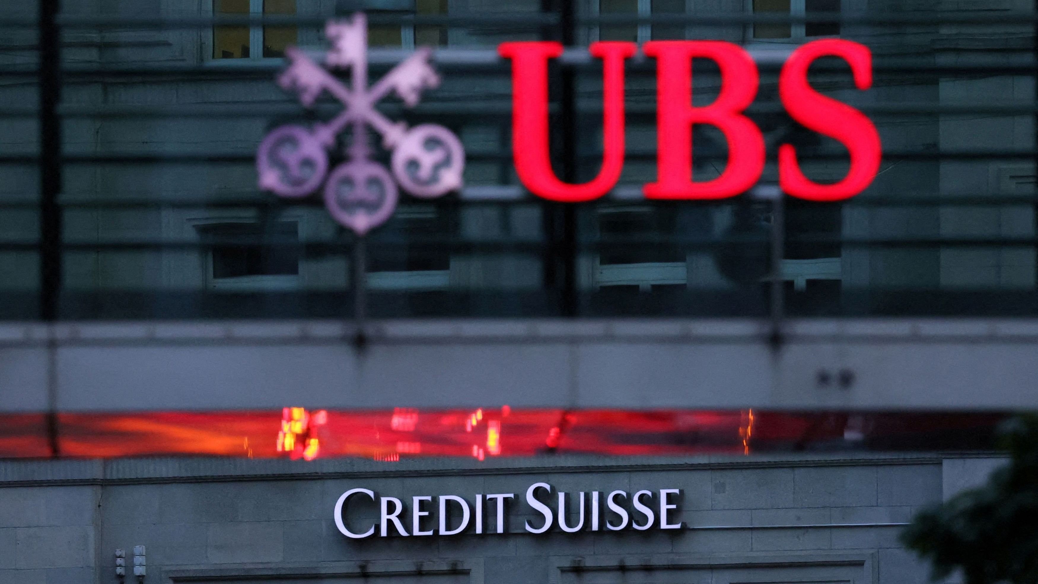 <div class="paragraphs"><p>Logos of Swiss banks Credit Suisse and UBS are seen.</p></div>