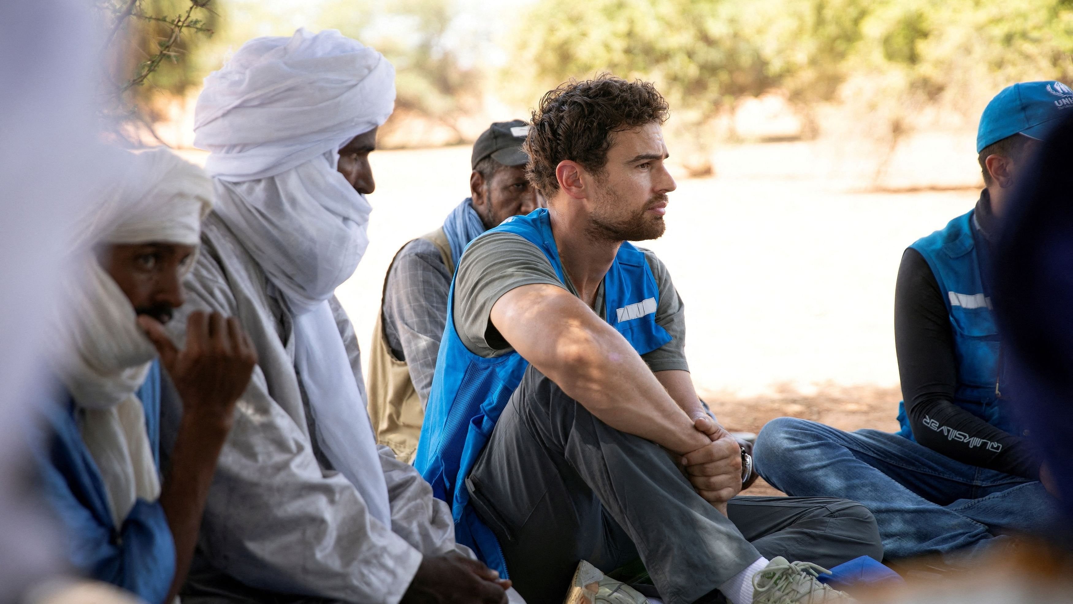 <div class="paragraphs"><p>Actor and UNHCR goodwill ambassador Theo James sits during a visit to Aghor, while on a trip with the United Nations refugee agency, in Mauritania, October 9, 2024. </p></div>