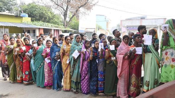 <div class="paragraphs"><p>Women stand in a queue to cast their votes at a polling station during the first phase of Jharkhand Assembly elections.</p></div>