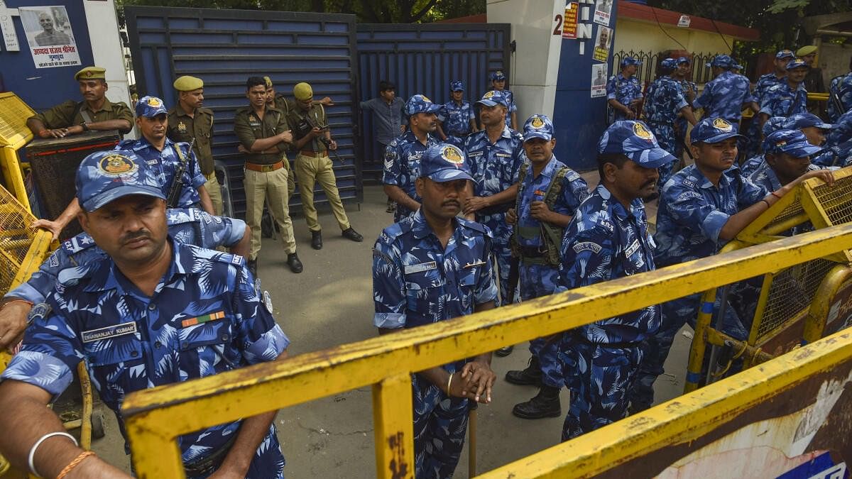 <div class="paragraphs"><p>Security personnel stand guard outside UPSC office in Prayagraj on Wednesday.</p></div>