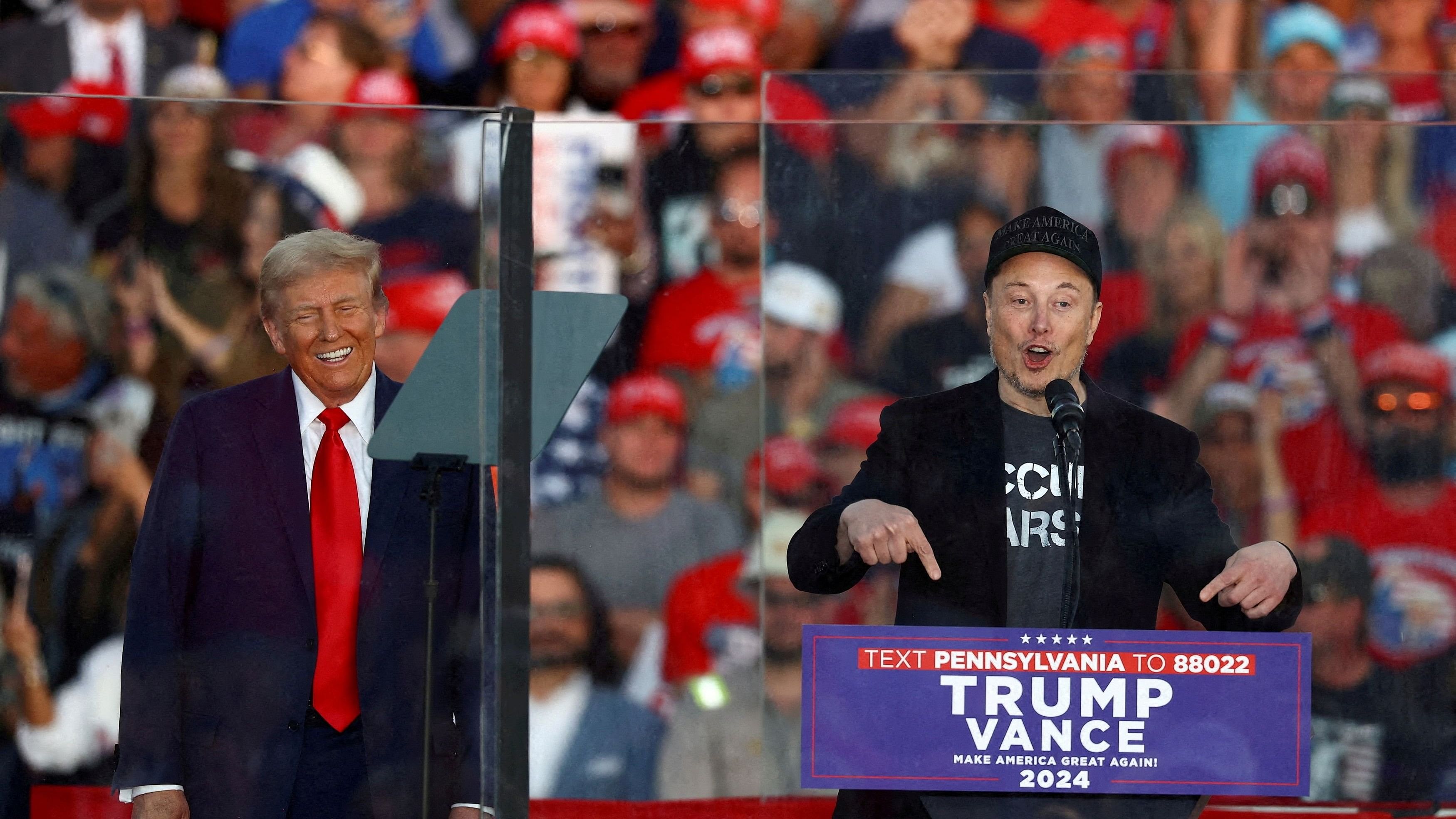 <div class="paragraphs"><p> Tesla CEO and X owner Elon Musk speaks as   Donald Trump reacts during a rally.</p></div>