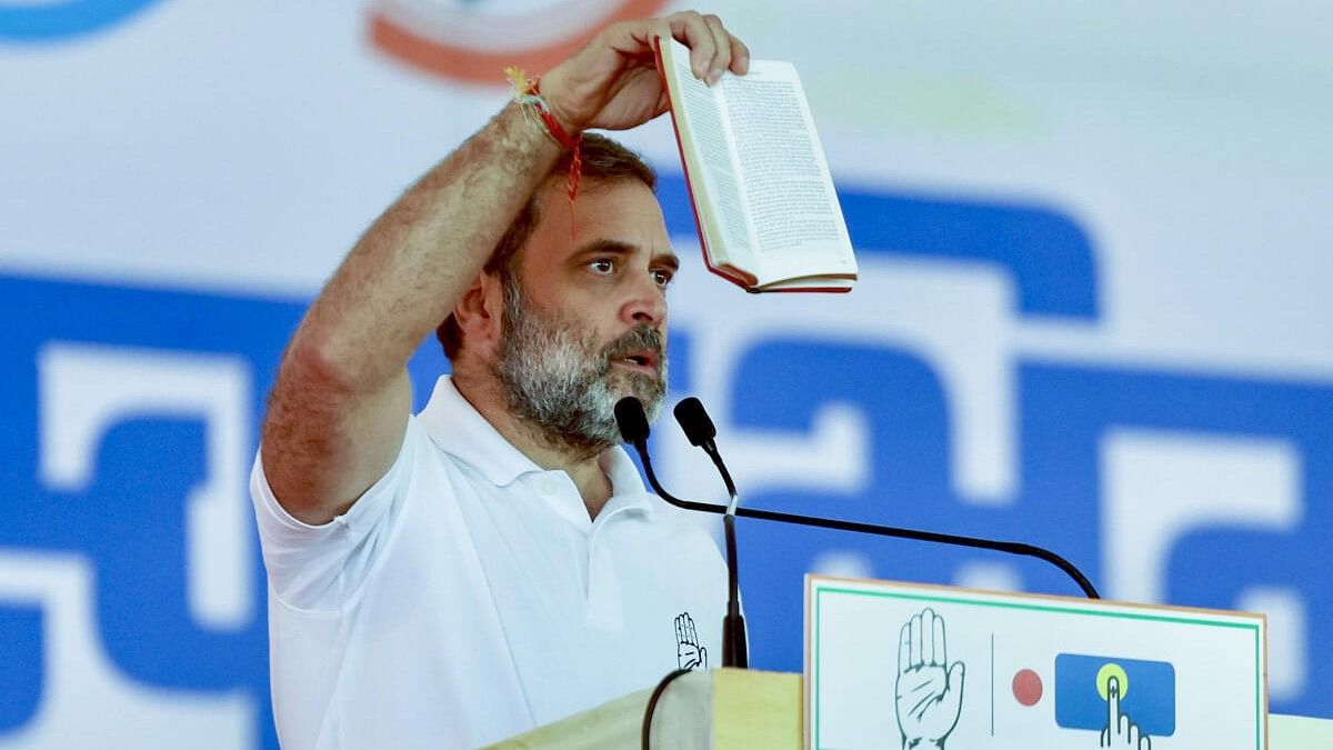 <div class="paragraphs"><p>Rahul Gandhi holds a copy of the Constitution while addressing an election rally at Nandurbar in Maharashtra.</p></div>