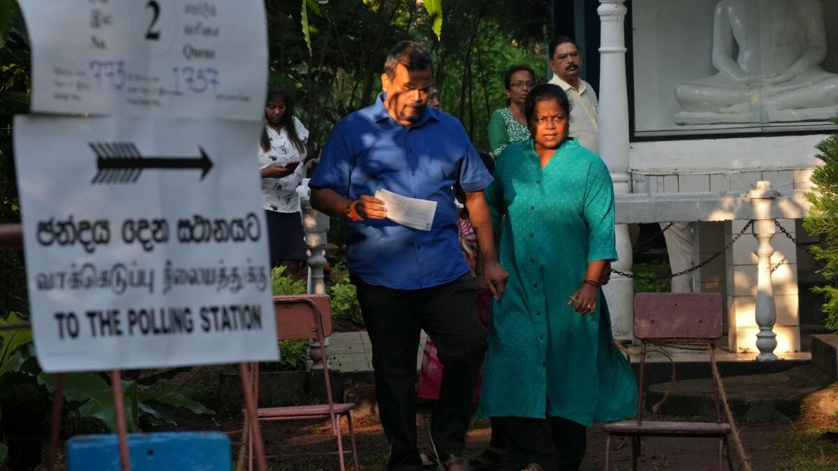 <div class="paragraphs"><p>People leave a polling station after voting on the day of the parliamentary election, in Colombo, Sri Lanka, November 14, 2024.</p></div>