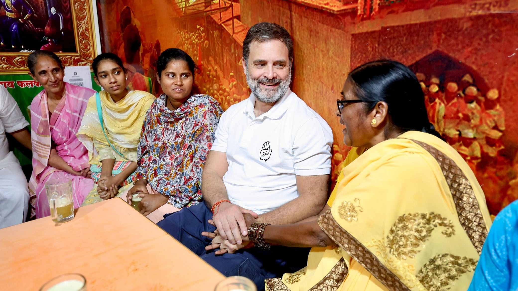 <div class="paragraphs"><p>Rahul Gandhi interacts with women as he makes a stop to enjoy sugarcane juice.&nbsp;</p></div>