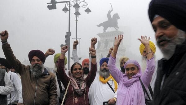 <div class="paragraphs"><p>Sikh pilgrims raise religious slogans before departing for Pakistan to participate in celebrations marking the birth anniversary of Guru Nanak Dev, in Amritsar, Thursday, Nov. 14, 2024</p></div>