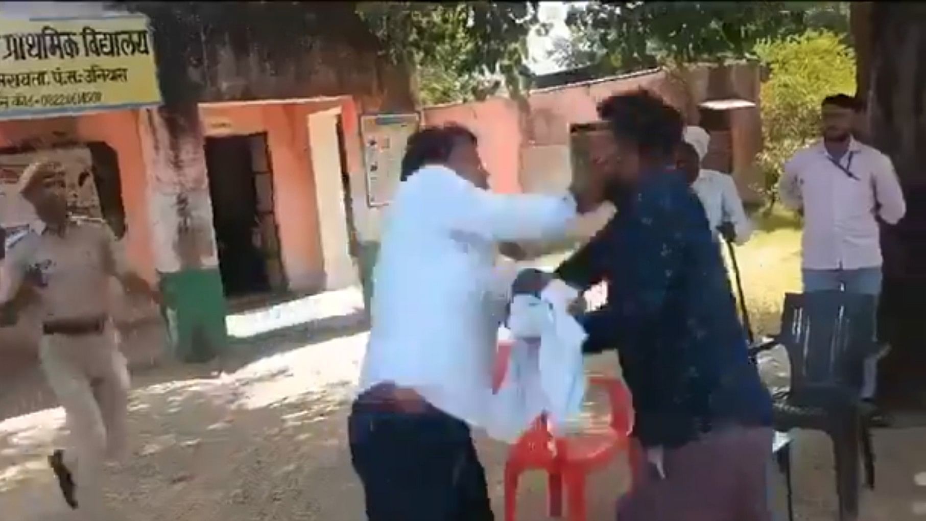 <div class="paragraphs"><p>Screengrab from a video showing independent candidate Naresh Meena assaulting an officer at a polling booth in Rajasthan.</p></div>