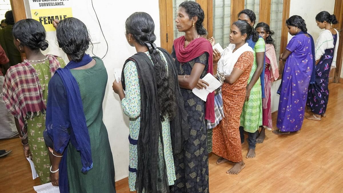 <div class="paragraphs"><p>Tribal voters wait to cast their votes for the Wayanad Lok Sabha by-poll, Wednesday, Nov. 13, 2024. </p></div>