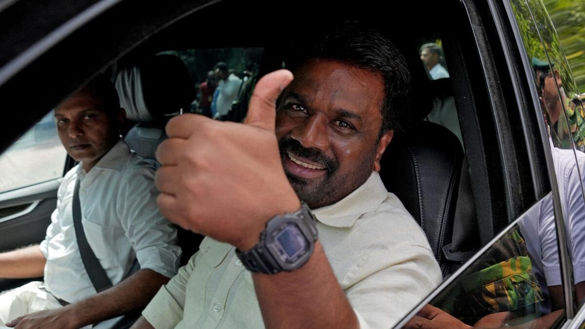 <div class="paragraphs"><p>Sri Lanka's President Anura Kumara Dissanayake gestures as he leaves after casting his vote in Colombo on Thursday.&nbsp;</p></div>