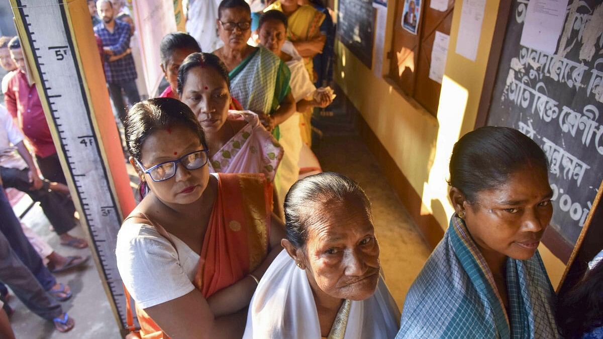 <div class="paragraphs"><p>Voters wait in a queue at a polling station in Samaguri during the bypoll on November 13.&nbsp;</p></div>