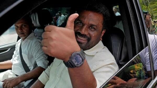 <div class="paragraphs"><p>Sri Lanka's President and National People's Power (NPP) party leader Anura Kumara Dissanayake gestures as he leaves after casting his vote on the day of the parliamentary election in Colombo, Sri Lanka, November 14, 2024</p></div>