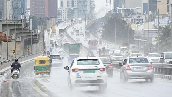 <div class="paragraphs"><p>ehicles wade through during in rain on Air port road flyover near Jakkuru in Bengaluru.</p></div>