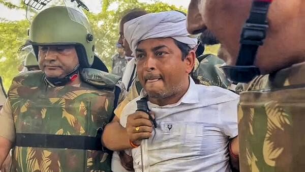 <div class="paragraphs"><p>Independent candidate Naresh Meena being arrested after he had allegedly slapped Malpura SDM during Deoli-Uniara Assembly by-poll, leading to violence in the area on Wednesday.</p></div>