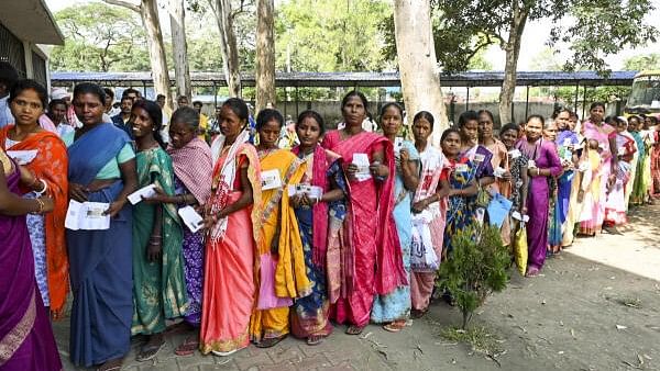 <div class="paragraphs"><p>People wait to cast their votes during the first phese of Jharkhand Assembly elections, in Ranchi, Wednesday.</p></div>