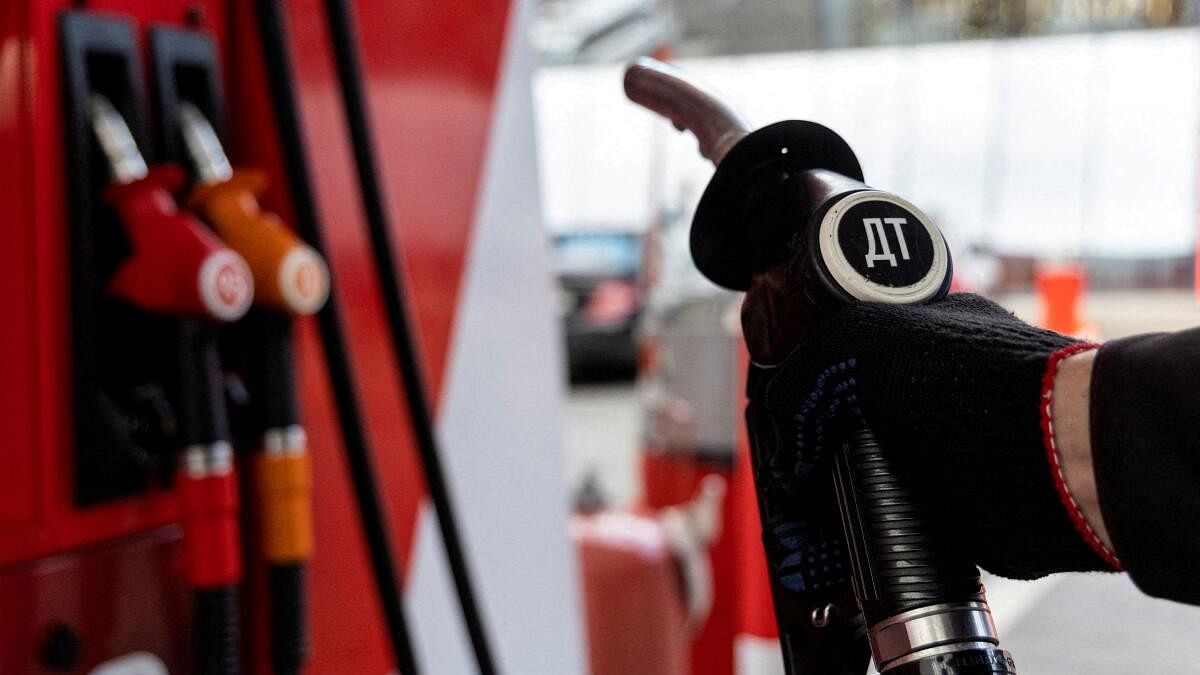 <div class="paragraphs"><p>An employee holds a diesel fuel pump nozzle at a petrol station of Neftmagistral company in Moscow, Russia.</p></div>