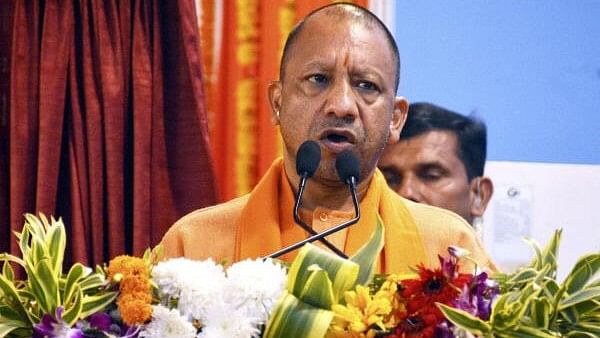 <div class="paragraphs"><p>Uttar Pradesh Chief Minister Yogi Adityanath addresses a gathering during the inauguration of the Namo Ghat on the Ganga river, in Varanasi, Friday.&nbsp;</p></div>