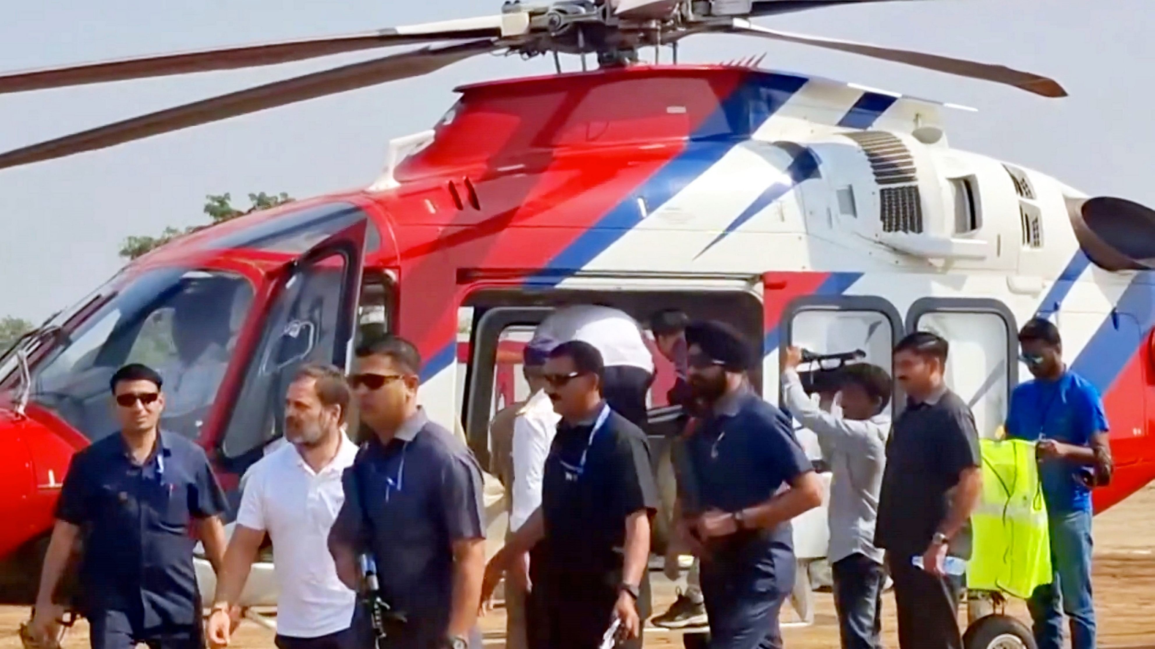 <div class="paragraphs"><p> LoP in Lok Sabha and Congress leader Rahul Gandhi's bags being checked by Election Commission officials after his helicopter landed at Dhamangaon, in Amravati district, Saturday, Nov. 16, 2024. </p></div>