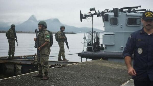 <div class="paragraphs"><p>Brazilian soldiers patrol Guanabara Bay ahead of the G20 summit in Rio de Janeiro, Brazil.</p></div>