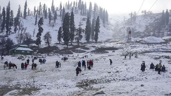 <div class="paragraphs"><p>Tourists play in the snow at a ski resort after season's first snowfall at Kongdoori area of Gulmarg, in Baramulla district, Jammu &amp; Kashmir.</p></div>