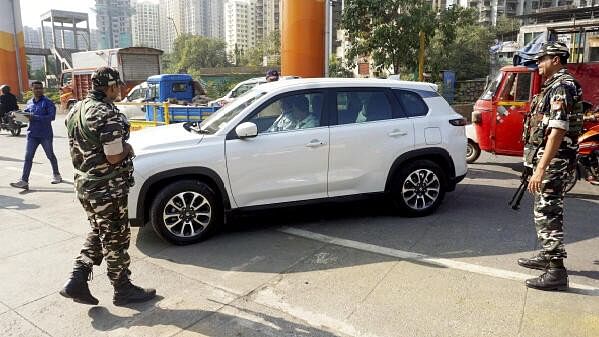 <div class="paragraphs"><p>Security personnel check vehicles ahead of Maharashtra Assembly elections</p></div>