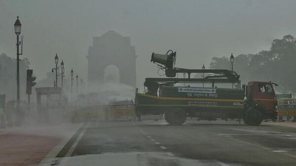 <div class="paragraphs"><p>An anti-smog vehicle sprinkle water at the Kartavya Path near the India Gate amid smog, in New Delhi, on Friday.</p></div>