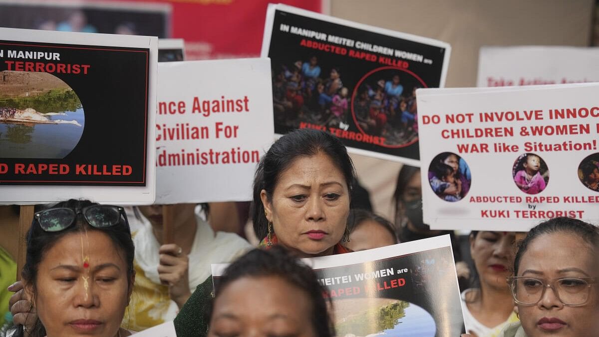 <div class="paragraphs"><p>People stage a protest after bodies of six people from the Meitei community were found, days after they were taken hostage by suspected Kuki insurgents in Manipur, at Jantar Mantar, in New Delhi.</p></div>