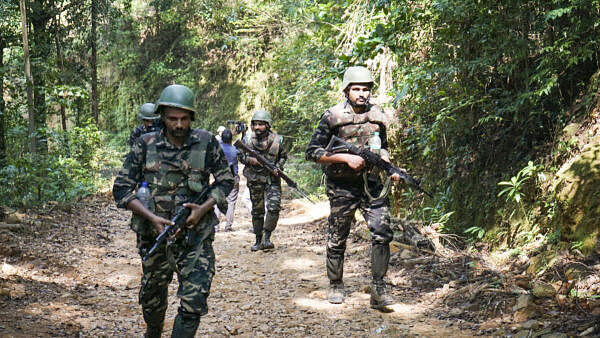 <div class="paragraphs"><p>Security personnel during a combing operation in Kabbinale forest area, in Udupi district, Karnataka. Vikram Gowda, a Naxalite, was shot dead by Anti-Naxal Force (ANF) during the operation, official sources said on Tuesday.</p></div>