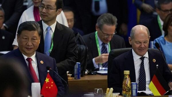 <div class="paragraphs"><p>China's President Xi Jinping (L) and German Chancellor Olaf Scholz (R) attend the G20 summit at the Museum of Modern Art in Rio de Janeiro, Brazil.</p></div>