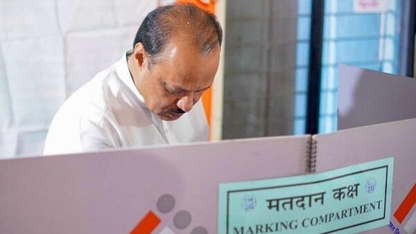 <div class="paragraphs"><p>Maharashtra Deputy Chief Minister Ajit Pawar casts his vote at a polling station at Katewadi during the Maharashtra Assembly Elections, in Pune district. </p></div>