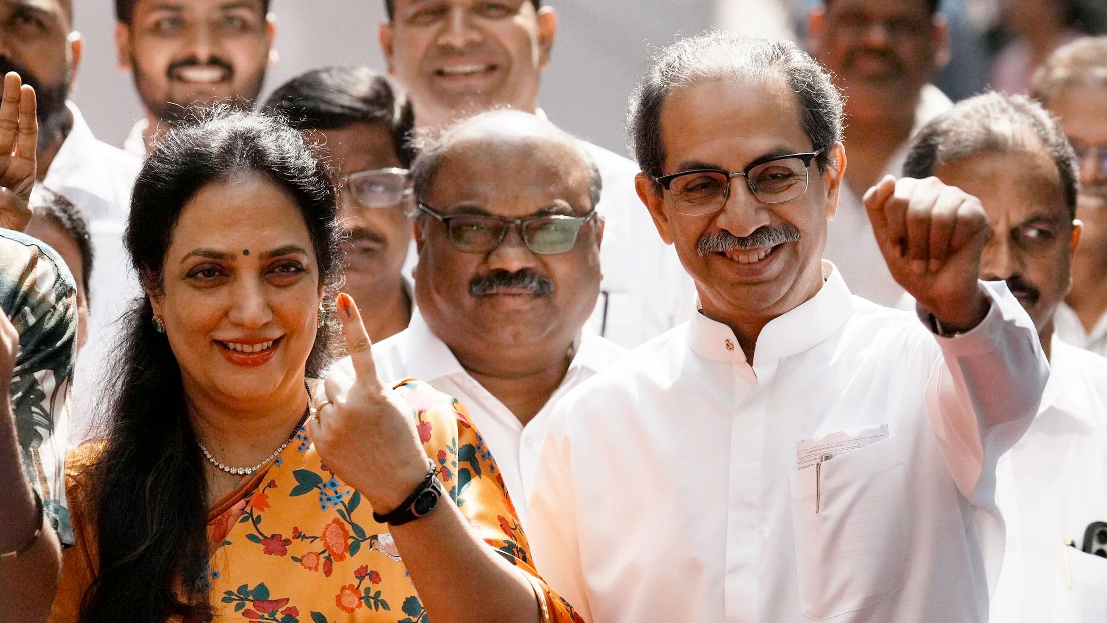 <div class="paragraphs"><p>Shiv Sena (UBT) chief Uddhav Thackeray with his wife Rashmi Thackeray shows his ink-marked finger after casting vote during the Maharashtra Assembly elections, in Mumbai.</p></div>