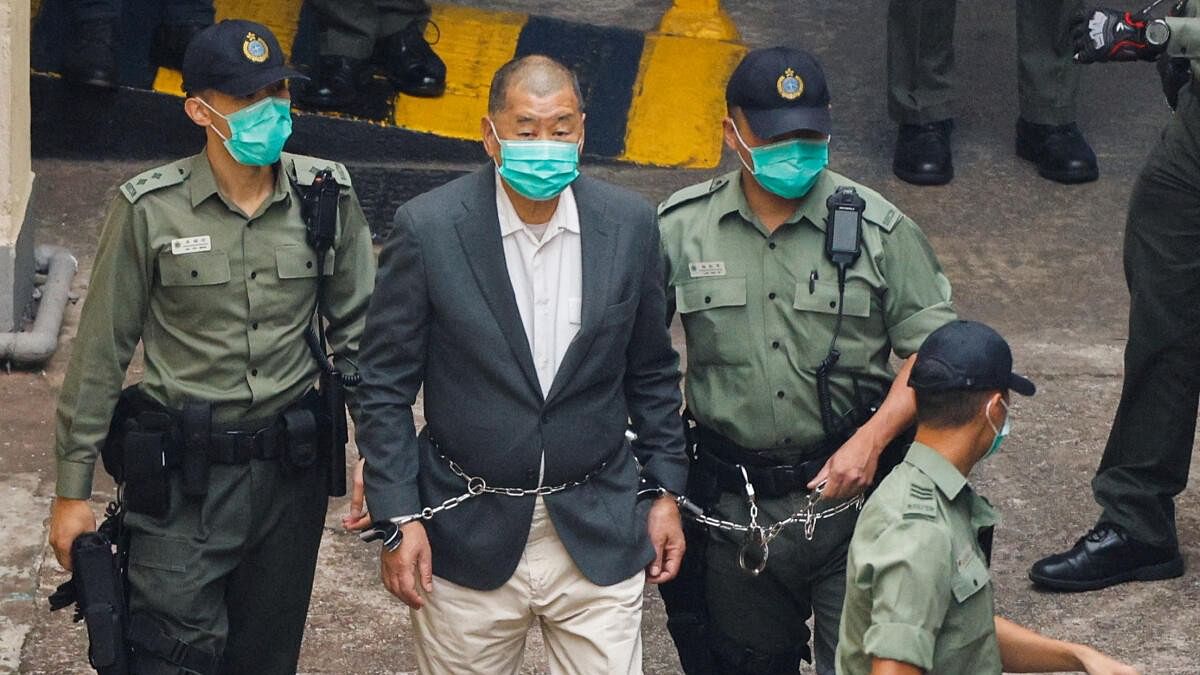 <div class="paragraphs"><p>Media mogul Jimmy Lai Chee-ying, founder of Apple Daily, walks to a prison van to head to court, after being charged under the national security law, in Hong Kong</p></div>