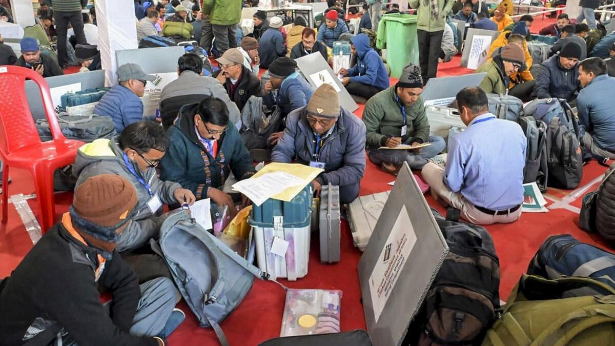 <div class="paragraphs"><p> Polling officials check election material at a distribution center on the eve of the Kedarnath Assembly constituency bypoll, in Rudraprayag, Tuesday, Nov. 19, 2024. </p></div>