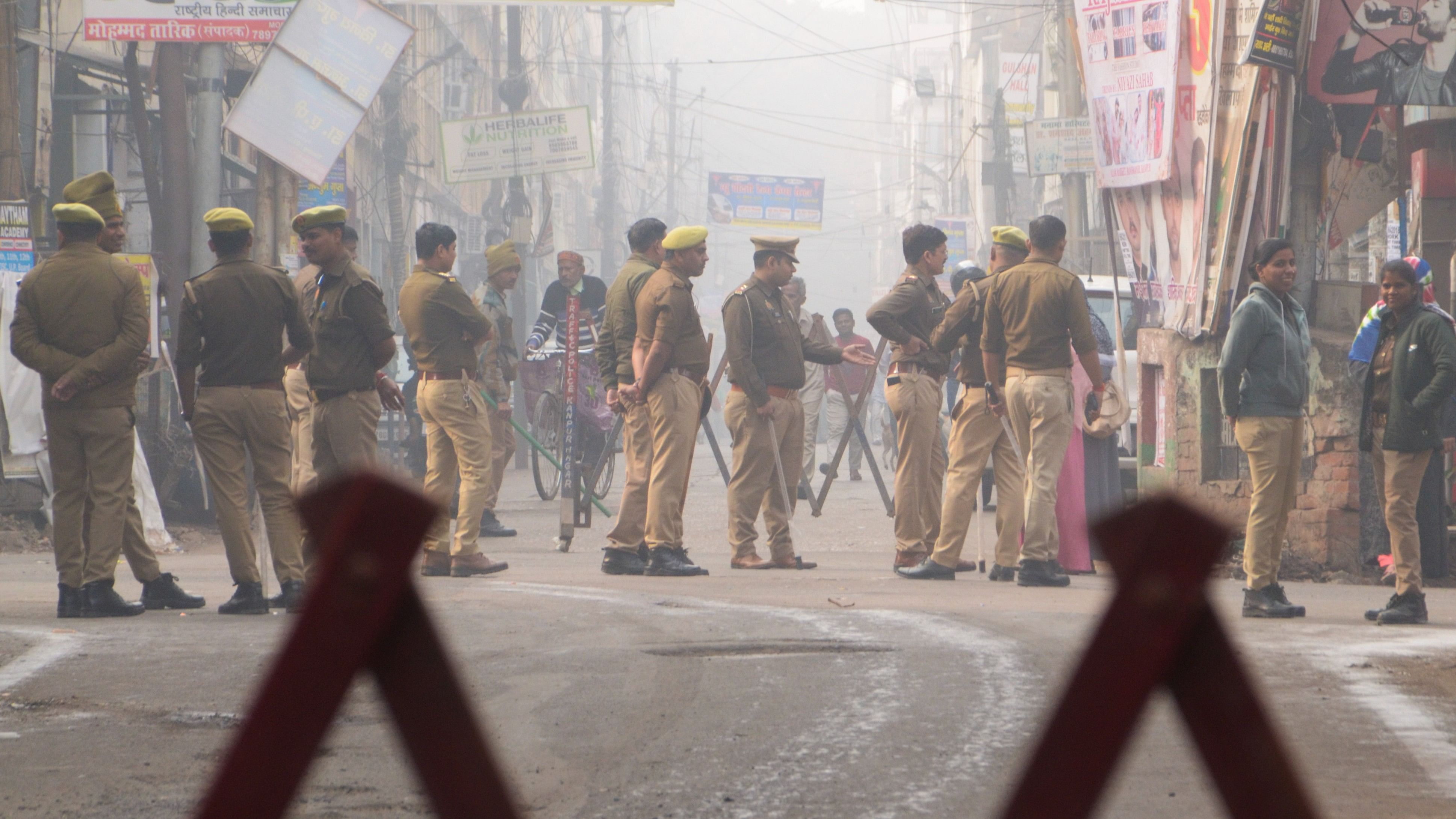 <div class="paragraphs"><p>Security personnel keep vigil near a polling booth during UP's Sishamau Assembly constituency bypoll, in Kanpur, Wednesday, Nov. 20, 2024.</p></div>