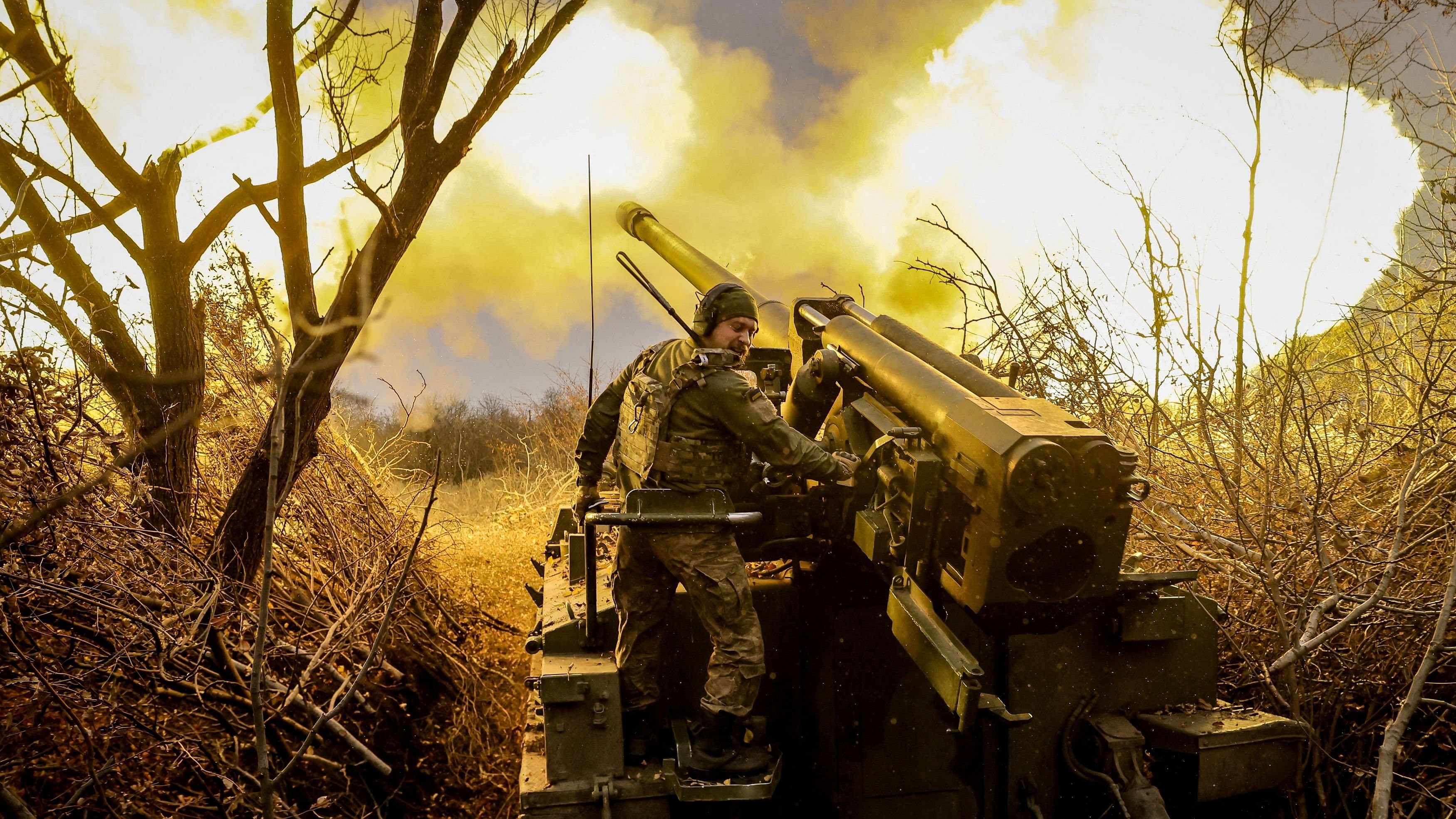 <div class="paragraphs"><p>A serviceman of the Ukrainian Armed Forces fires towards Russian troops.</p></div>