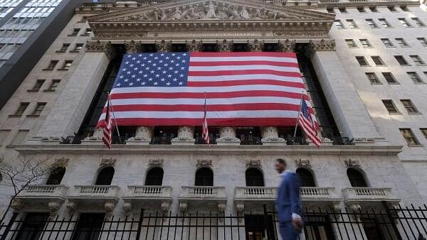 <div class="paragraphs"><p>US flags hang on the building of the New York Stock Exchange (NYSE), after US President-elect Donald Trump won the presidential election, in New York City, US.</p></div>