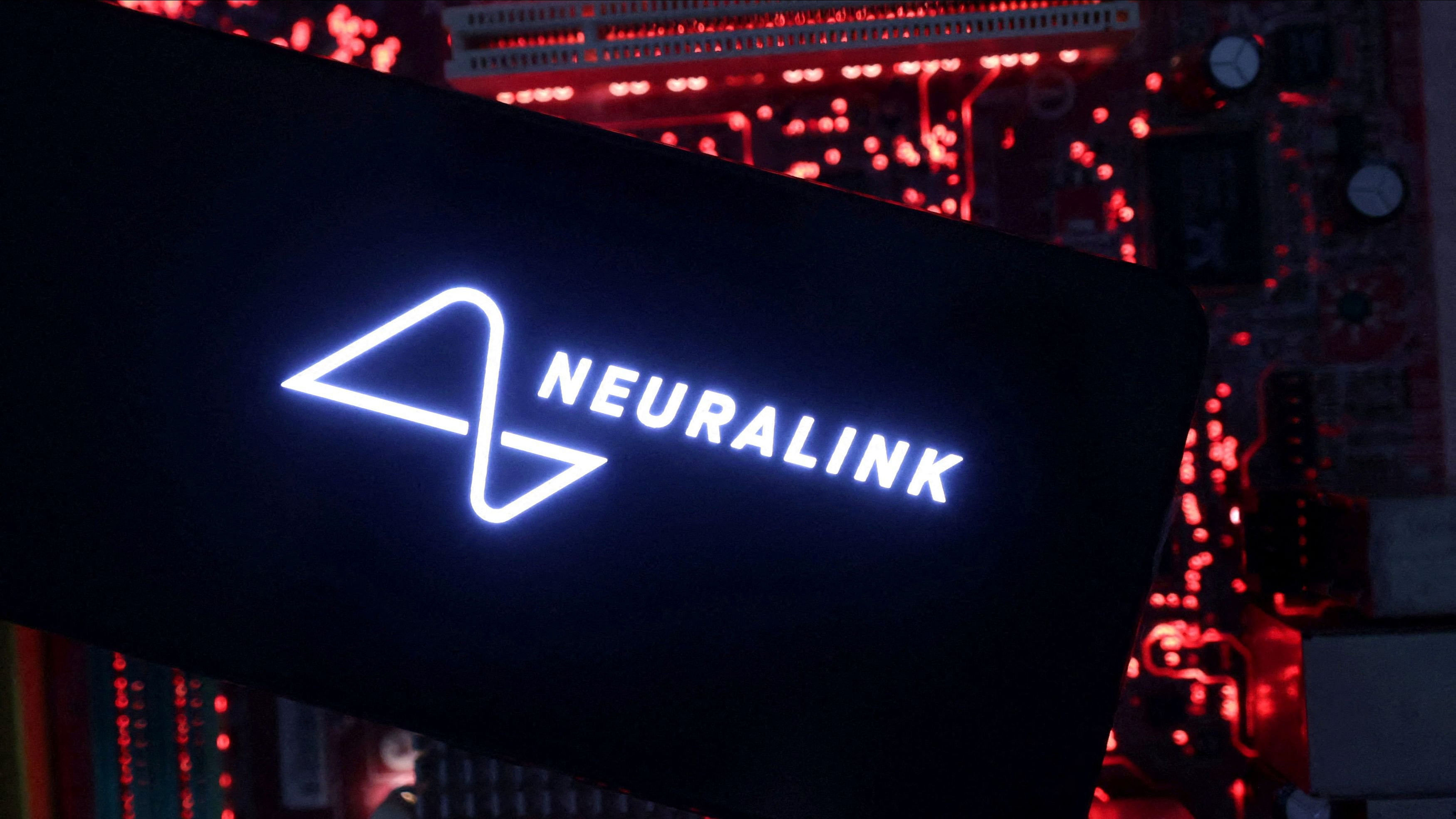 <div class="paragraphs"><p> A smartphone with a Neuralink logo displayed</p></div>