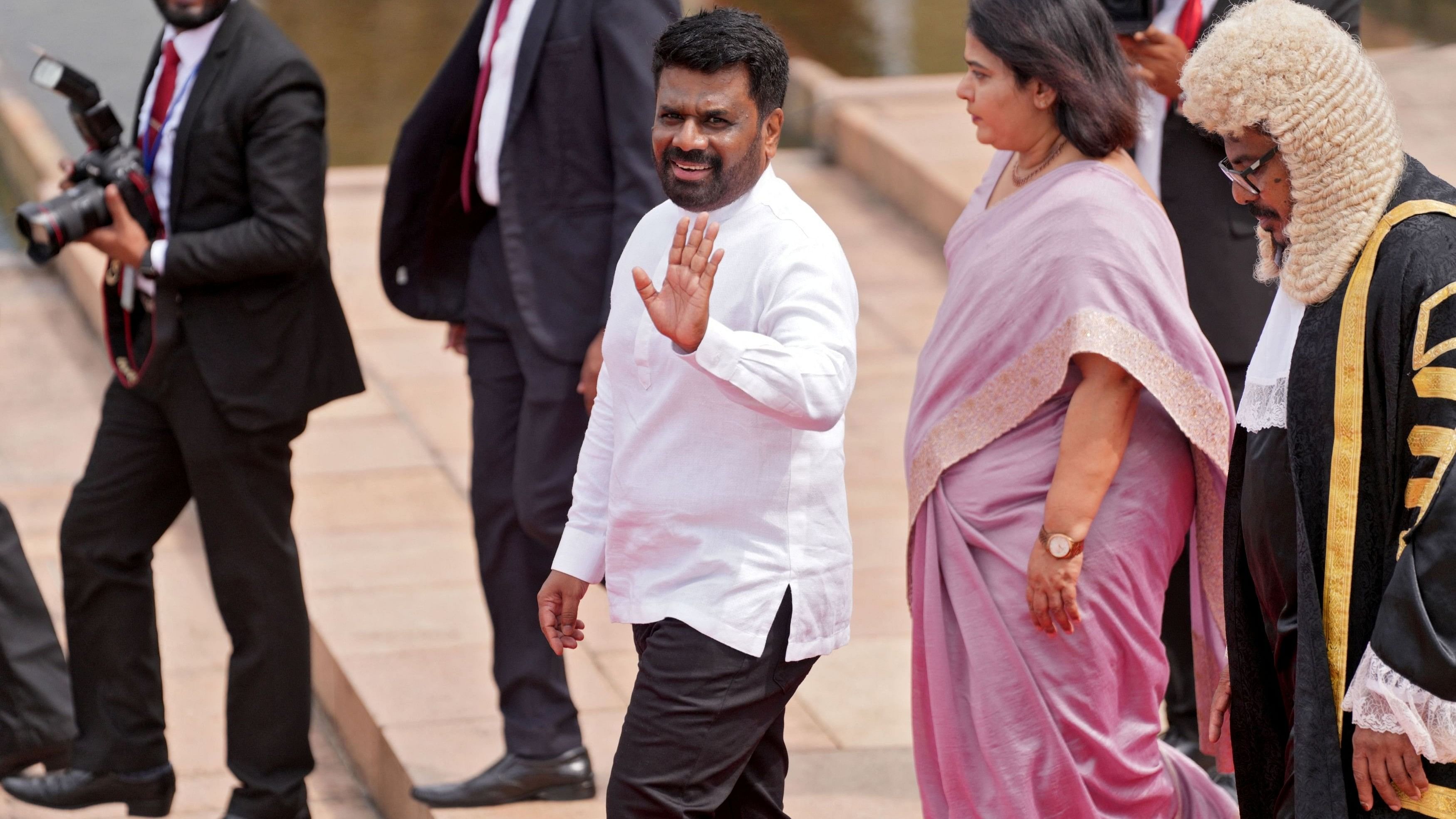 <div class="paragraphs"><p>Sri Lanka's President Anura Kumara Dissanayake waves as he leaves after attending the opening of the new session of parliament, in Colombo, Sri Lanka, November 21, 2024.</p></div>