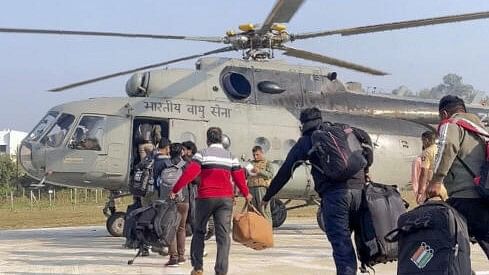 <div class="paragraphs"><p>Polling officials with election material board a helicopter as they leave for their respective polling booths located in Naxal-hit sensitive areas on the eve of voting for the Maharashtra Assembly polls, at Aheri Assembly constituency in Gadchiroli district, Maharashtra.</p></div>