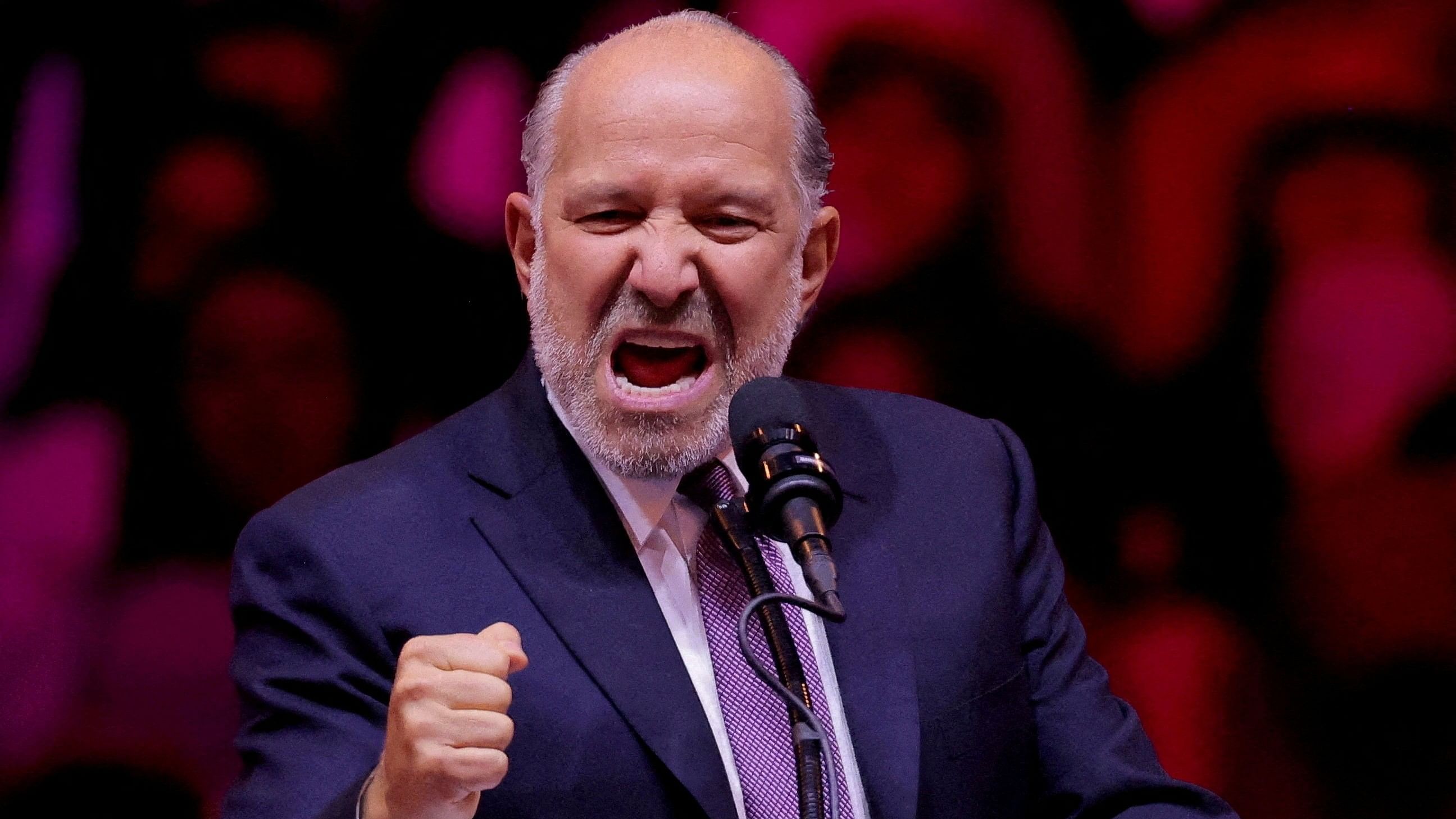 <div class="paragraphs"><p>Howard Lutnick, Chairman and CEO of Cantor Fitzgerald, gestures as he speaks during a rally for Republican presidential nominee and former US President Donald Trump at Madison Square Garden, in New York</p></div>