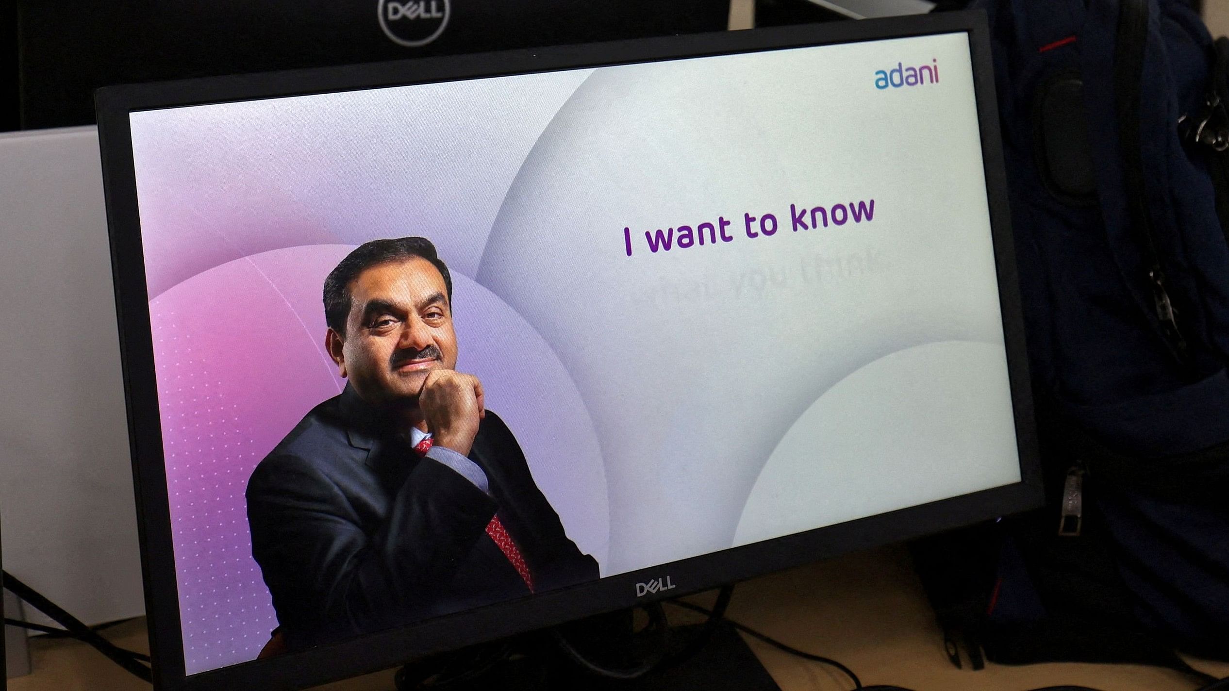 <div class="paragraphs"><p>Gautam Adani is seen on a computer monitor.</p></div>