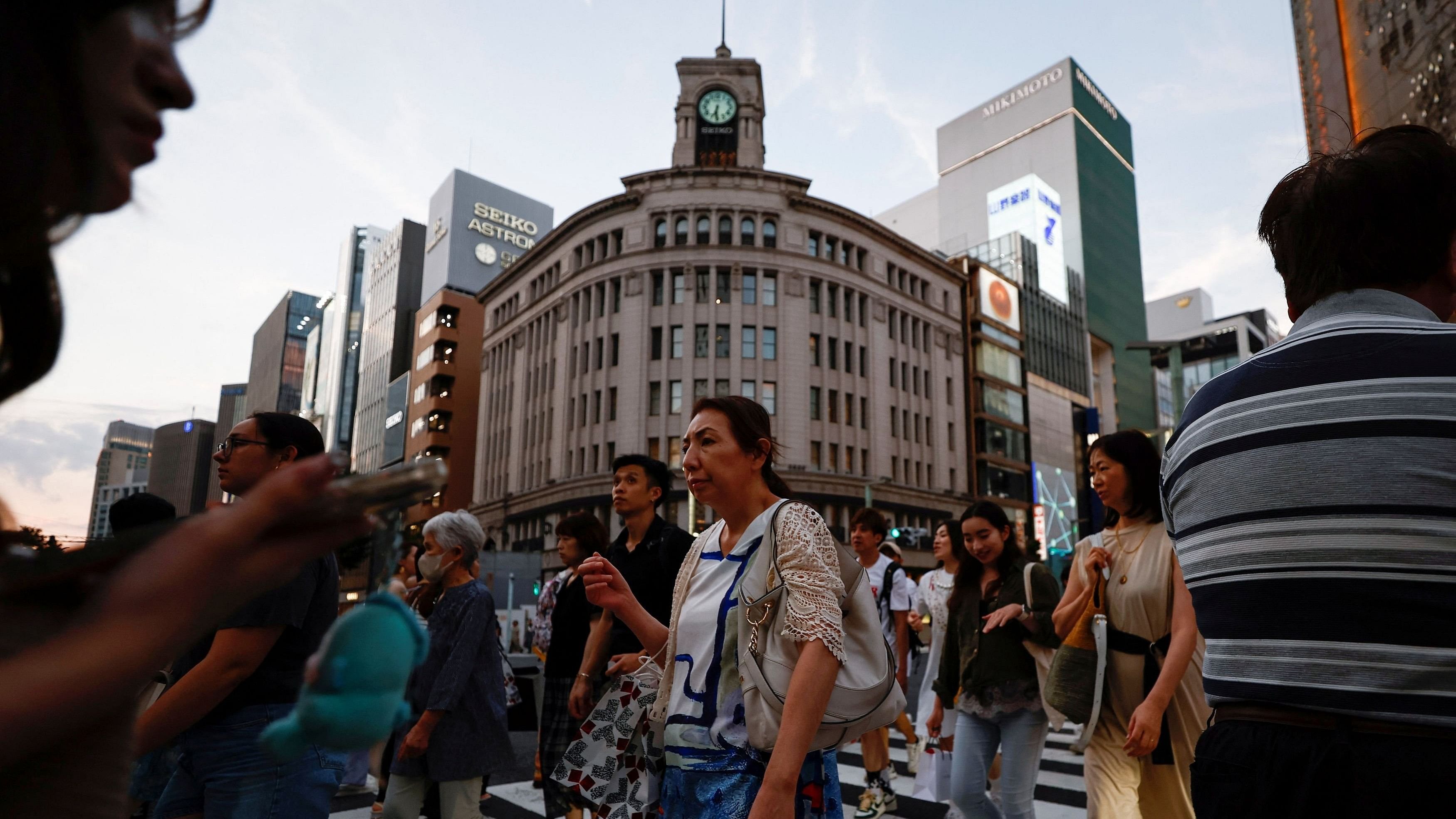 <div class="paragraphs"><p>People cross the street at Ginza shopping district in Tokyo, Japan</p></div>